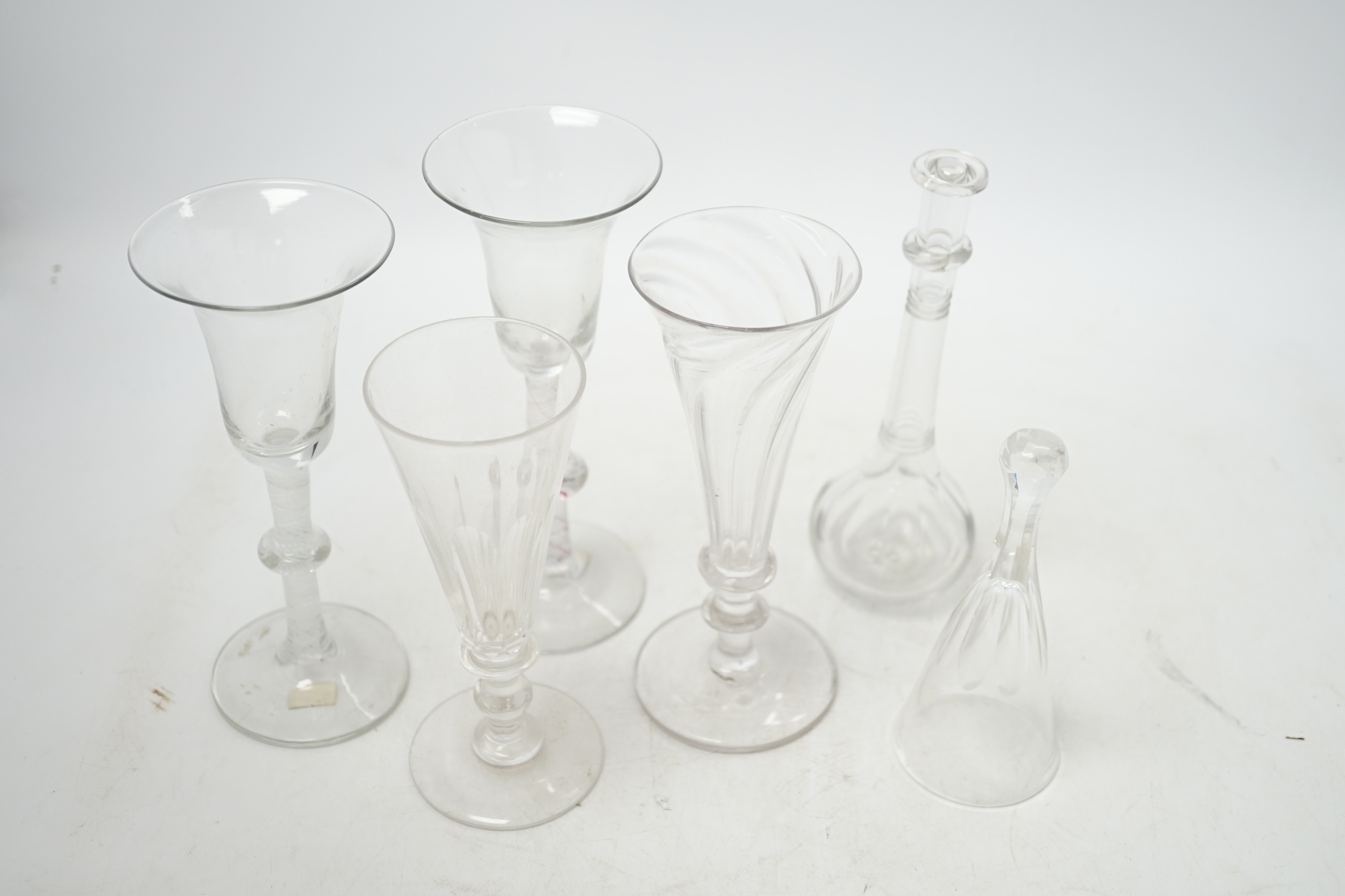 Two 18th century Dutch wine glasses, colour twist and opaque twist stems, two ale glasses, a toddy lifter and a stirrup cup, tallest 16.5cm. Condition - good